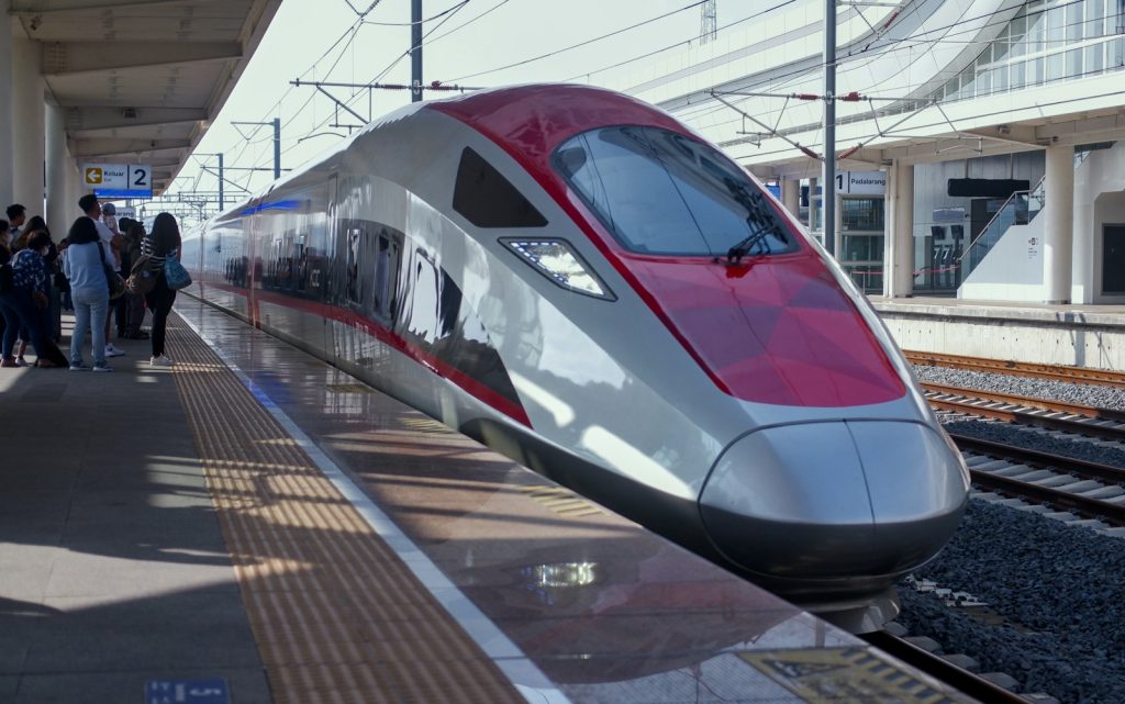 A high-speed train pulls into the station.