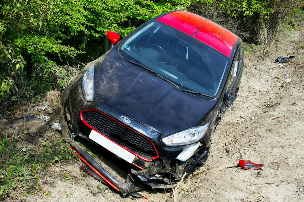 Damaged car after an accident on a dirt road in Welwyn Garden City, UK.
