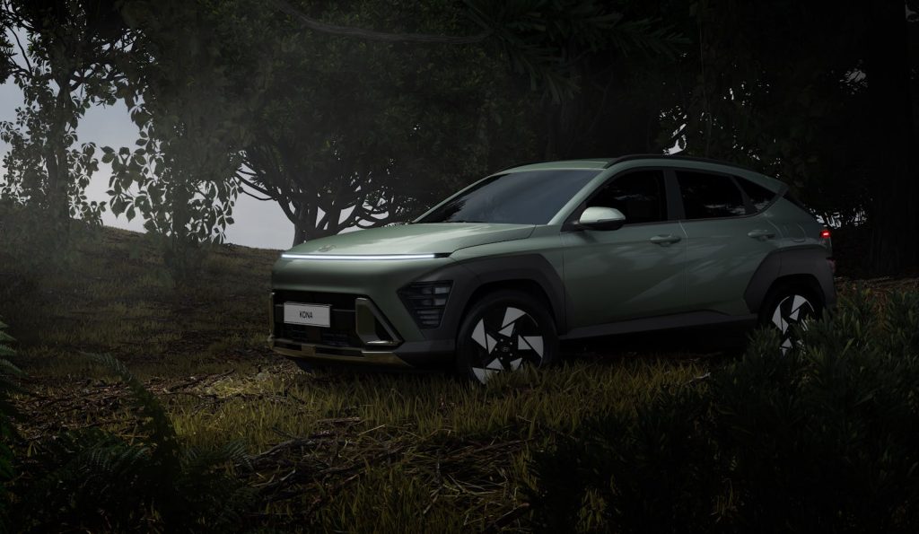 A pastel green SUV parked in a lush forest setting, perfect for adventure trips.