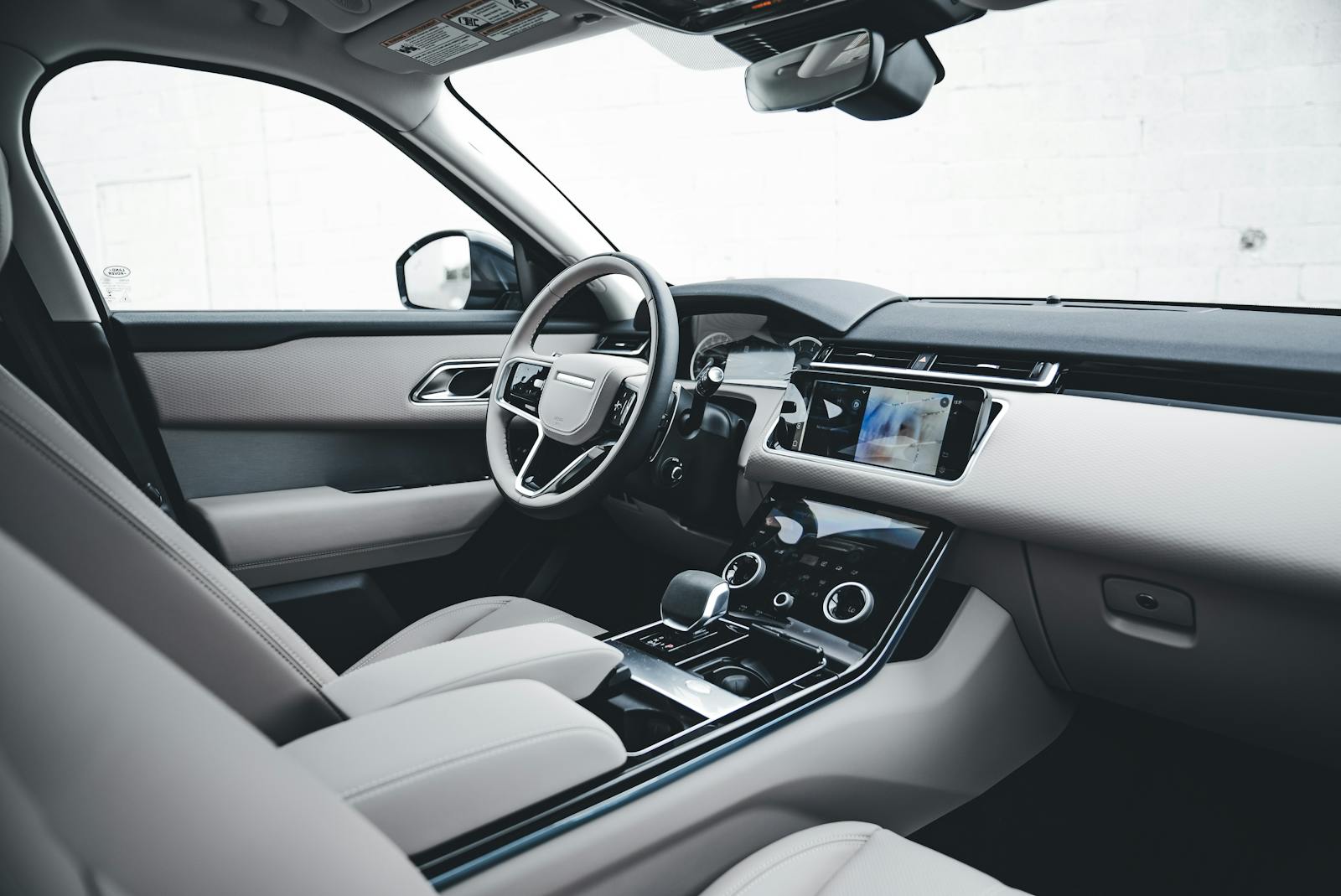 Explore the sleek design and modern features of a luxury car interior, showcasing advanced technology.