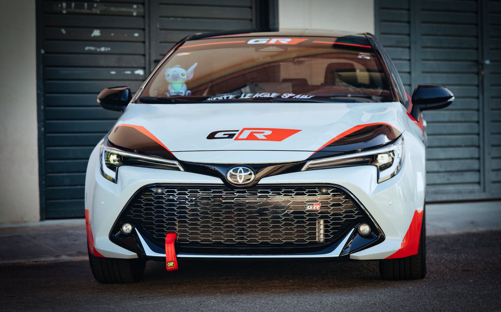 Stunning front view of a customized Toyota GR racing car with vibrant decals.