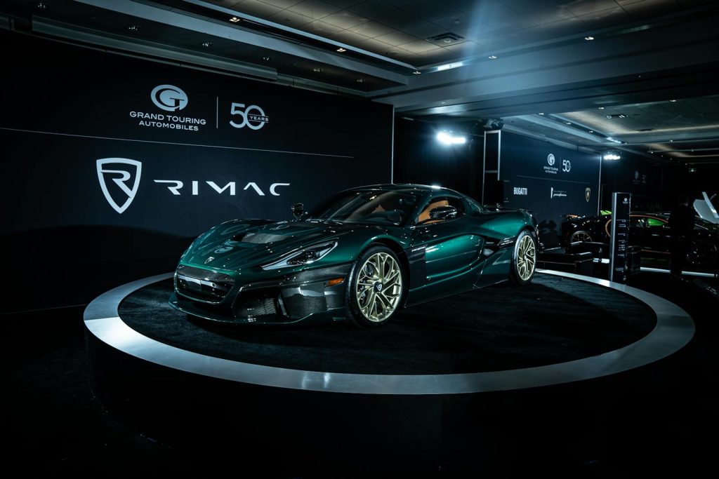 A Rimac electric sports car on display at an automotive event, showcasing sleek design and innovation.