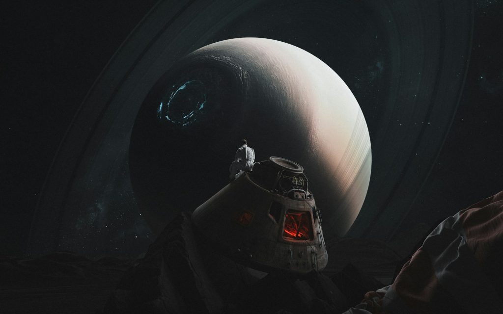 Astronaut standing on alien planet with saturn-like planet above