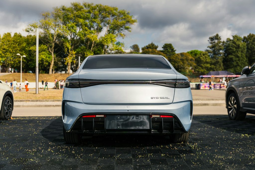 Two cars parked next to each other in a parking lot