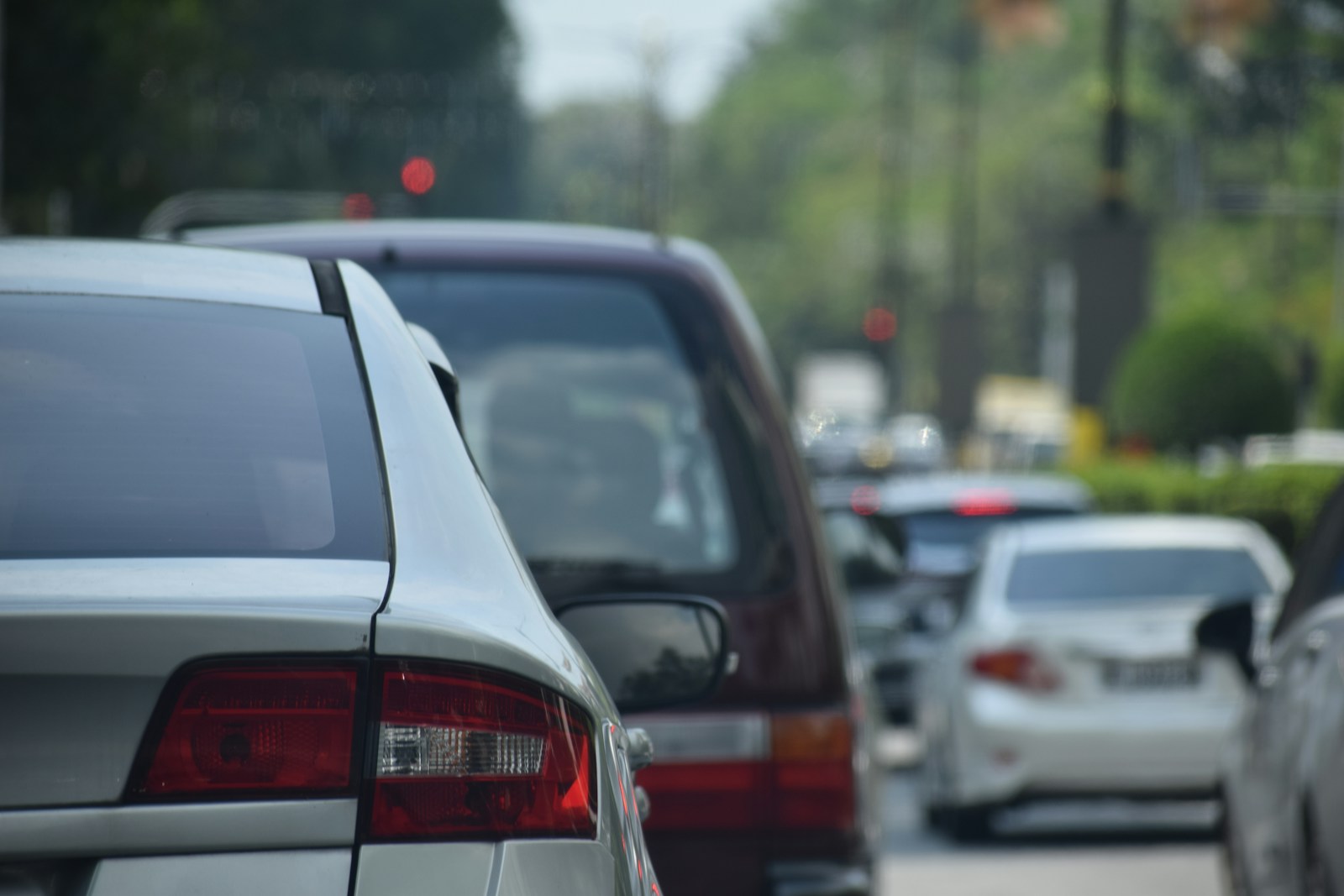 a bunch of cars that are parked in the street