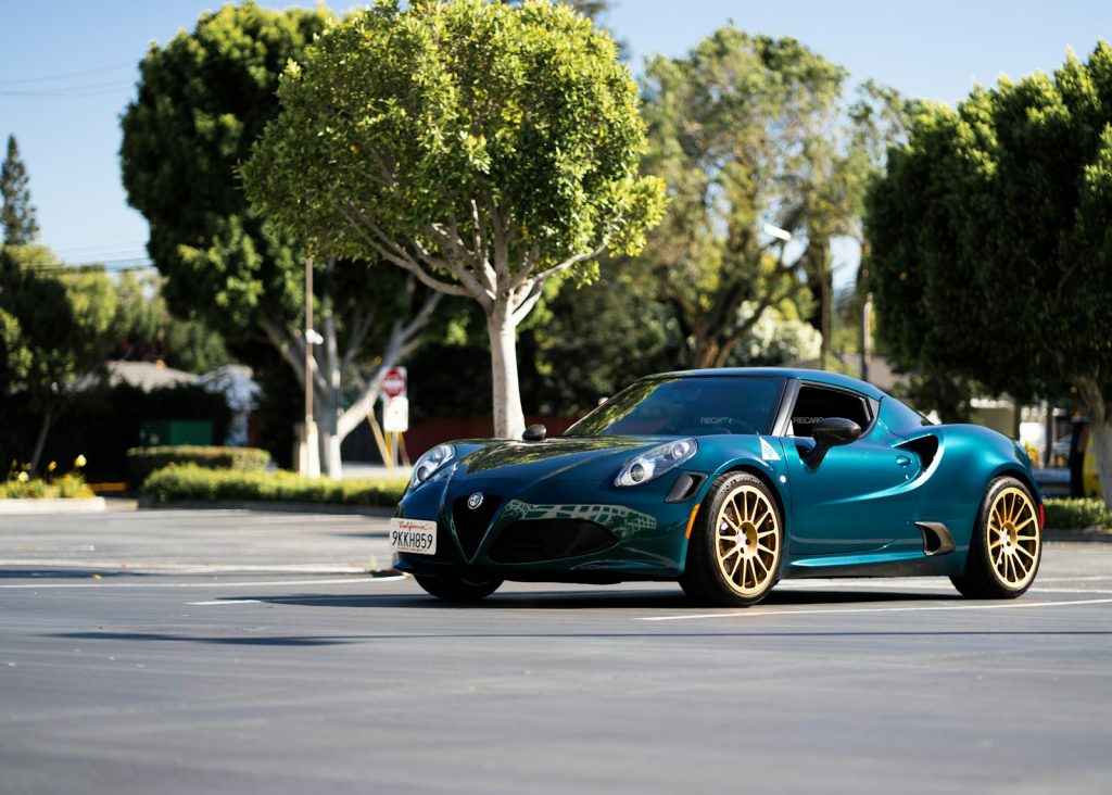 A blue sports car parked in a parking lot