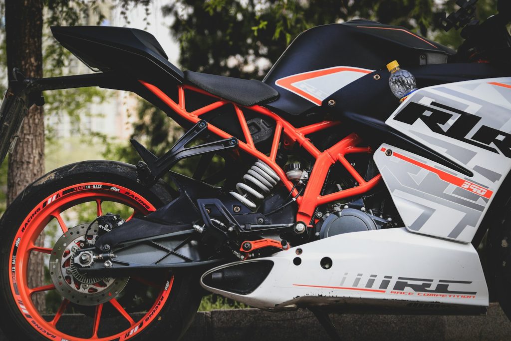 a motorcycle parked in a wooded area