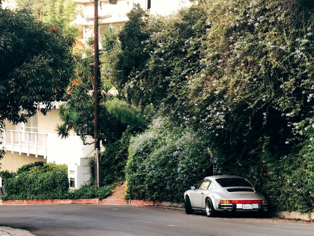 white porsche 911 on road during daytime