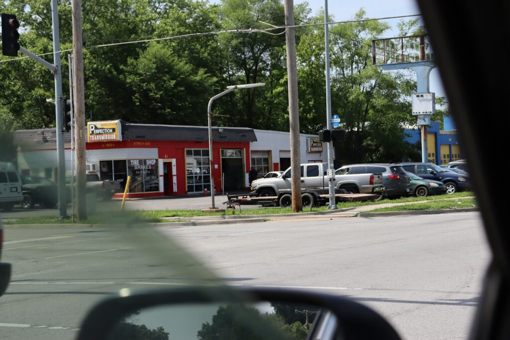 a red building sitting on the side of a road