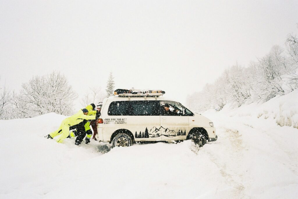 A couple of people that are standing in the snow