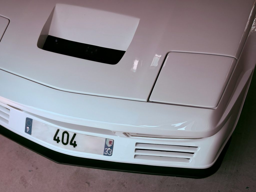 White sports car front with license plate