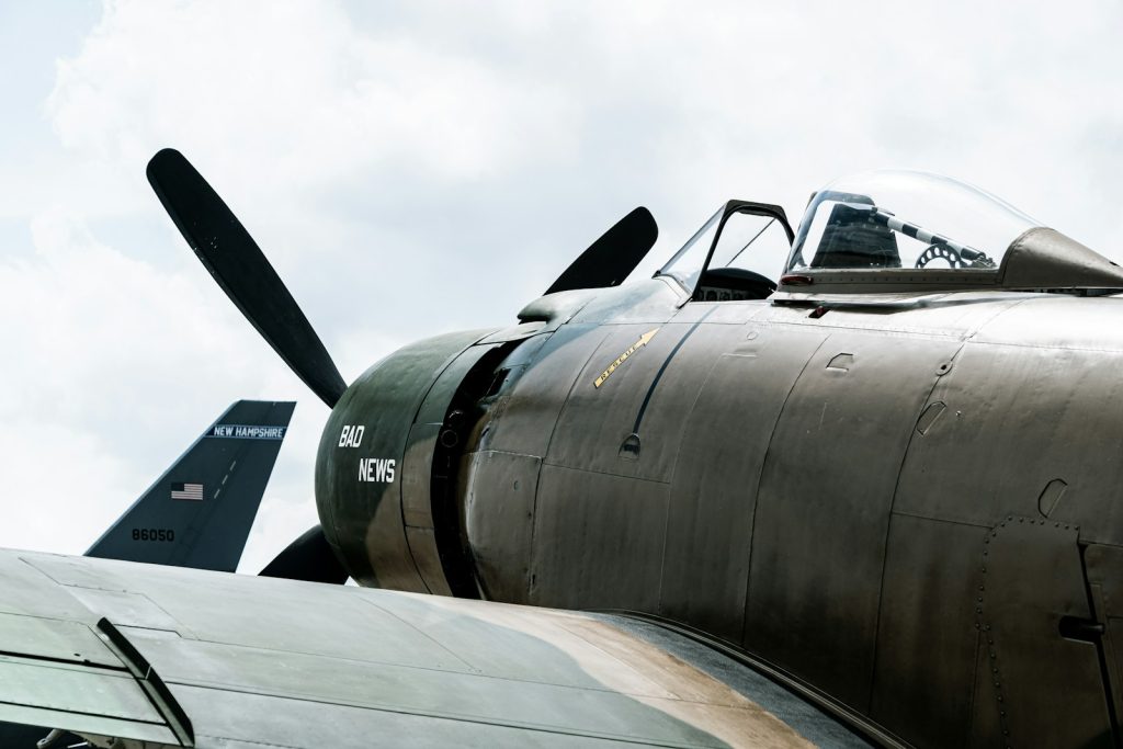 Close-up of a vintage military airplane propeller and cockpit