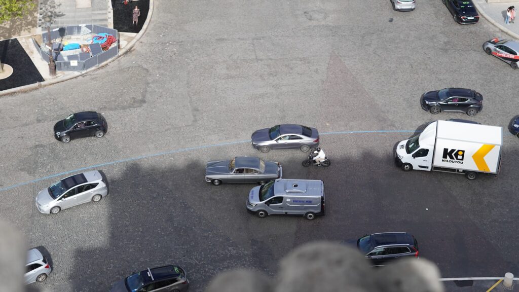 An aerial view of a parking lot full of cars