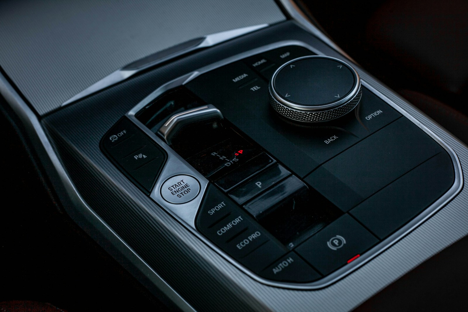 Close-up of modern car's center console controls.