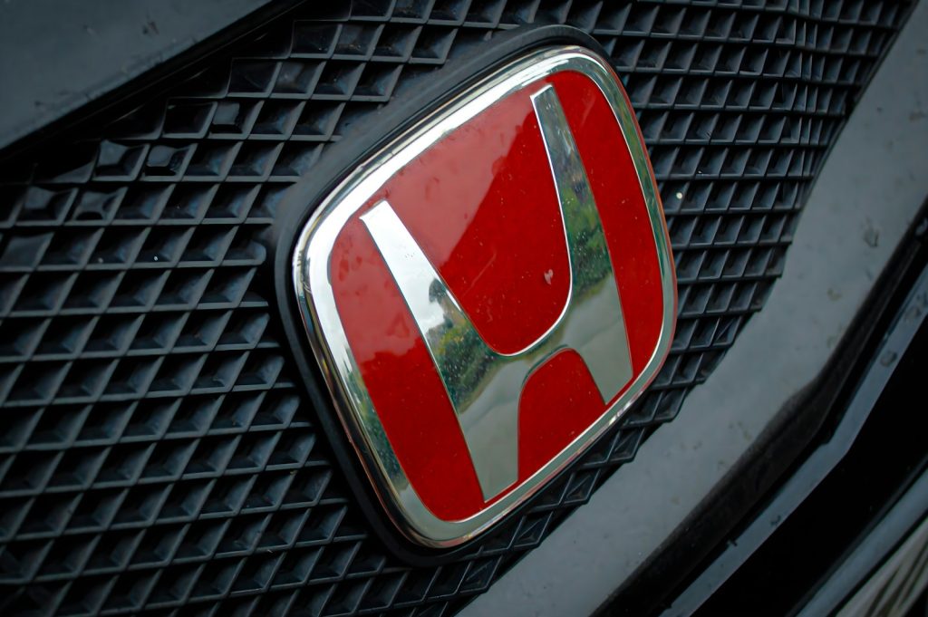 A close up of a honda emblem on a car
