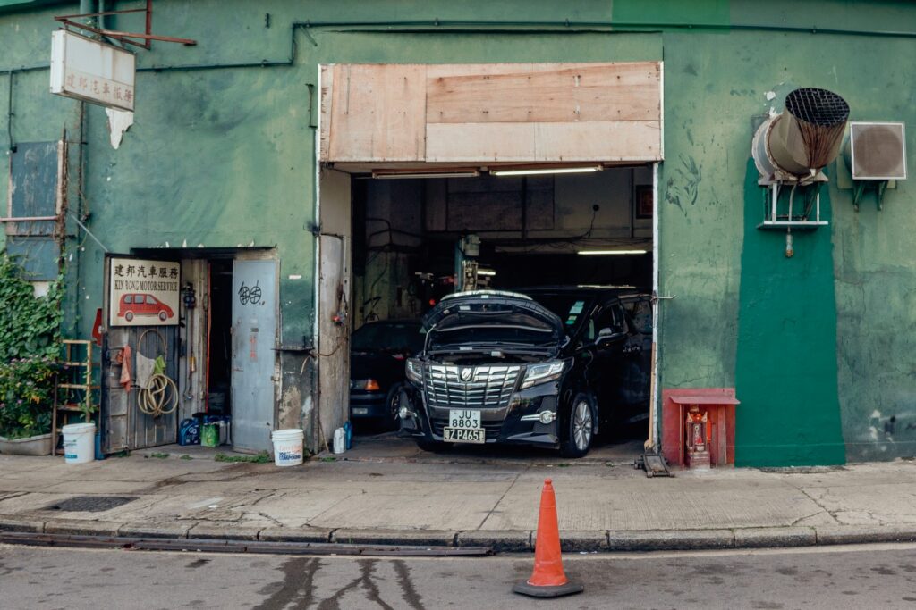 A car is parked in the garage of a building