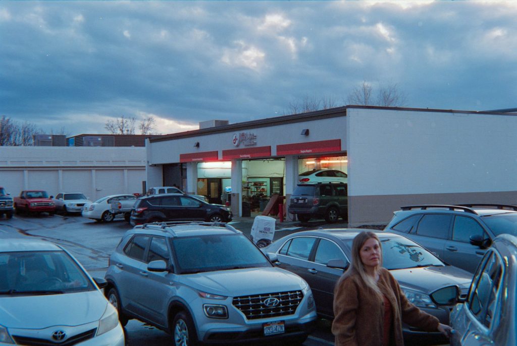 Cars parked in a lot outside a service center
