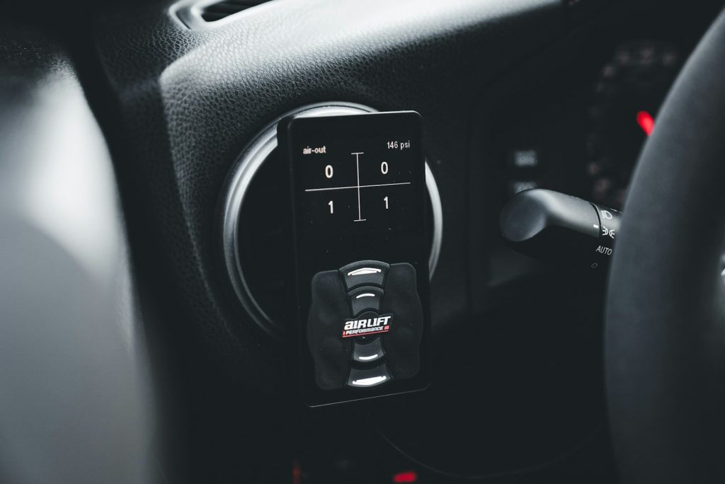 An in-car performance monitoring device is pictured.