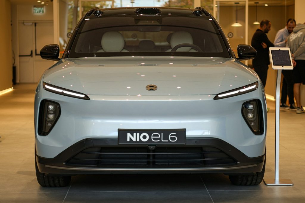 A nio el6 electric suv is shown indoors.
