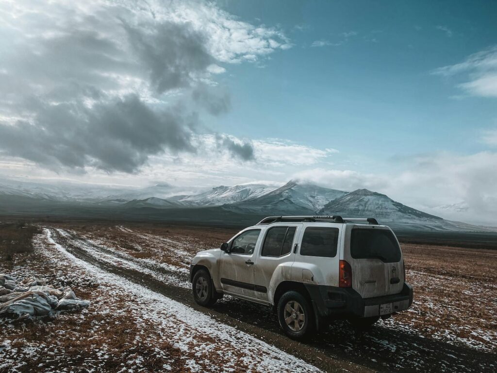 Explore the rugged beauty of Armenian mountains with a 4x4 offroad adventure on a snowy trail.
