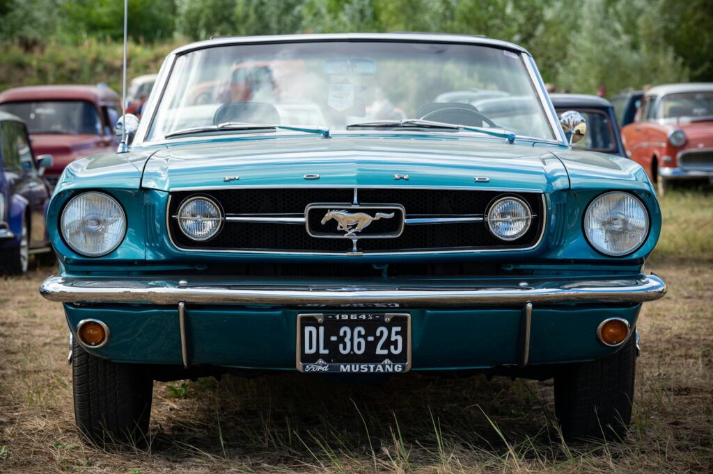 Front view of a classic 1964 Ford Mustang on display at a car show in Moerdijk, Netherlands.
