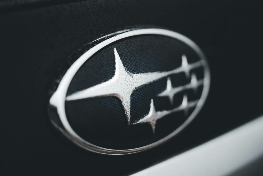 Detailed close-up of a Subaru car emblem, perfect for automotive branding and design themes.