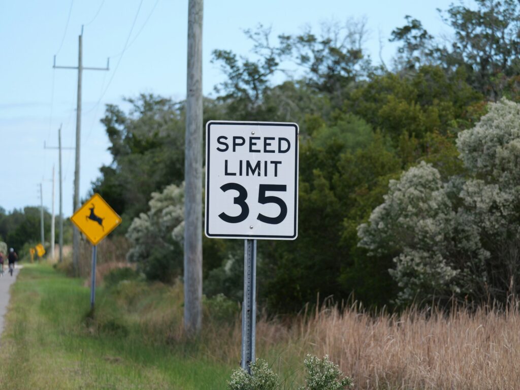 Speed limit sign with 35 on a rural road.