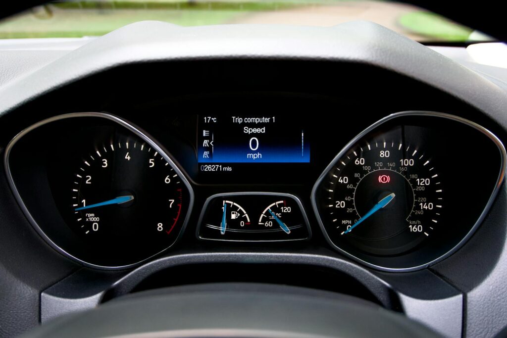 Close-up view of a Ford Focus dashboard showing the speedometer and various gauges.