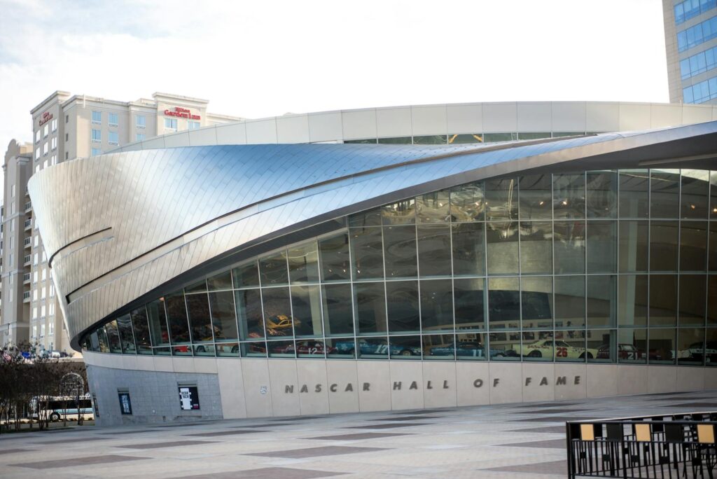 Explore the sleek design of the NASCAR Hall of Fame, showcasing modern architecture.