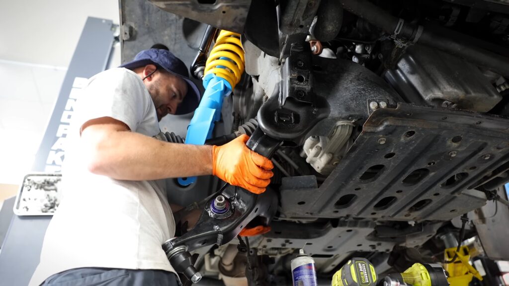 A man working on a car in a garage