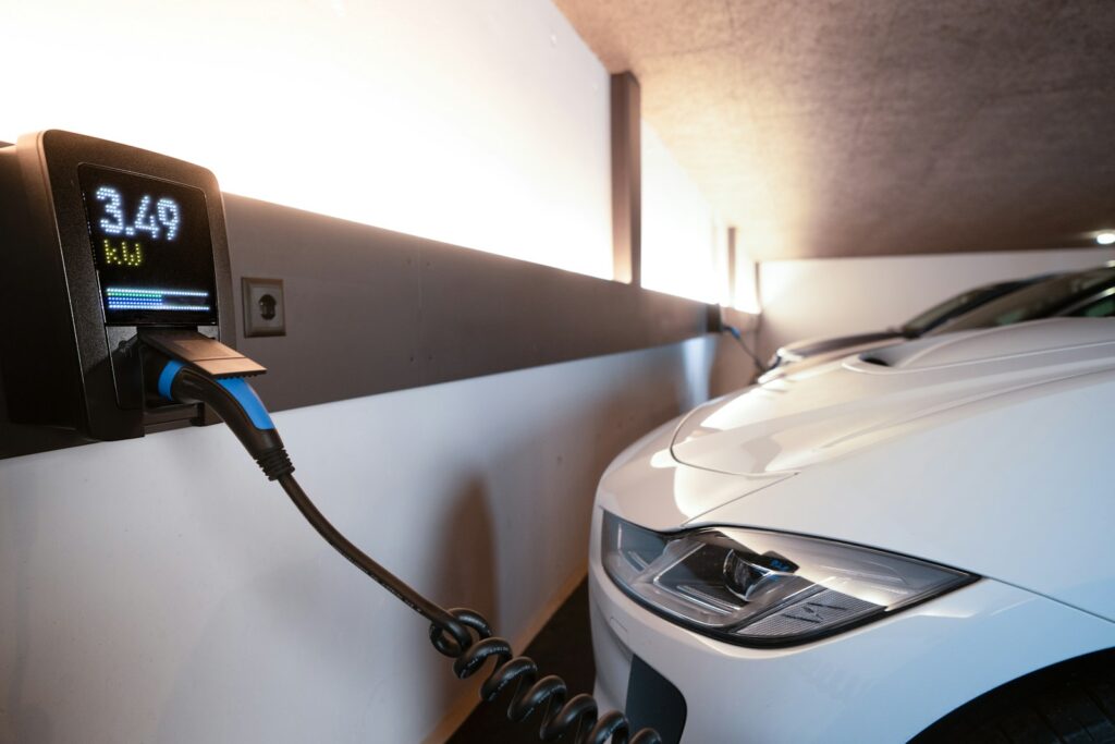 Electric car charging station with a white vehicle