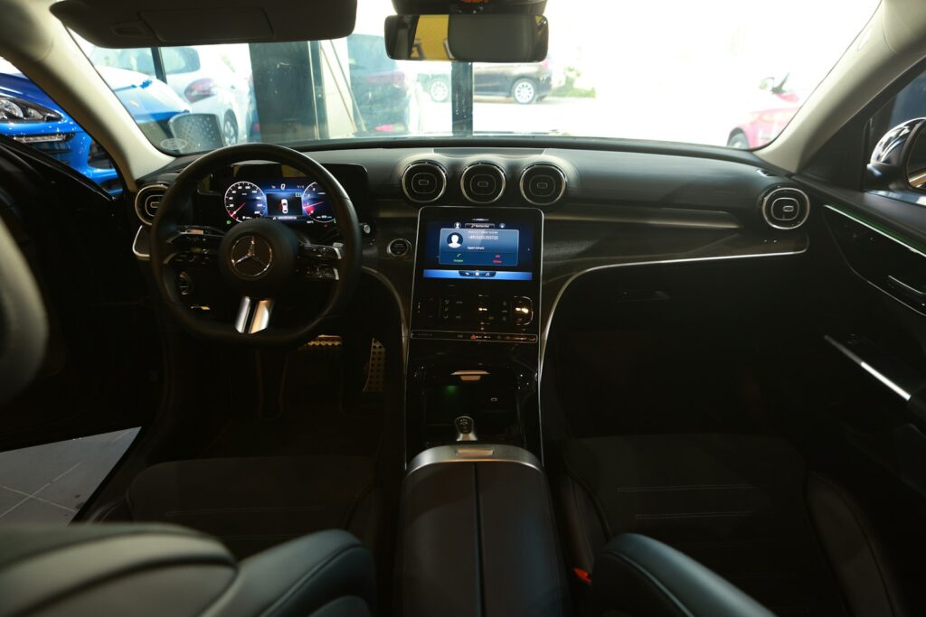 the interior of a car with a dash board and steering wheel
