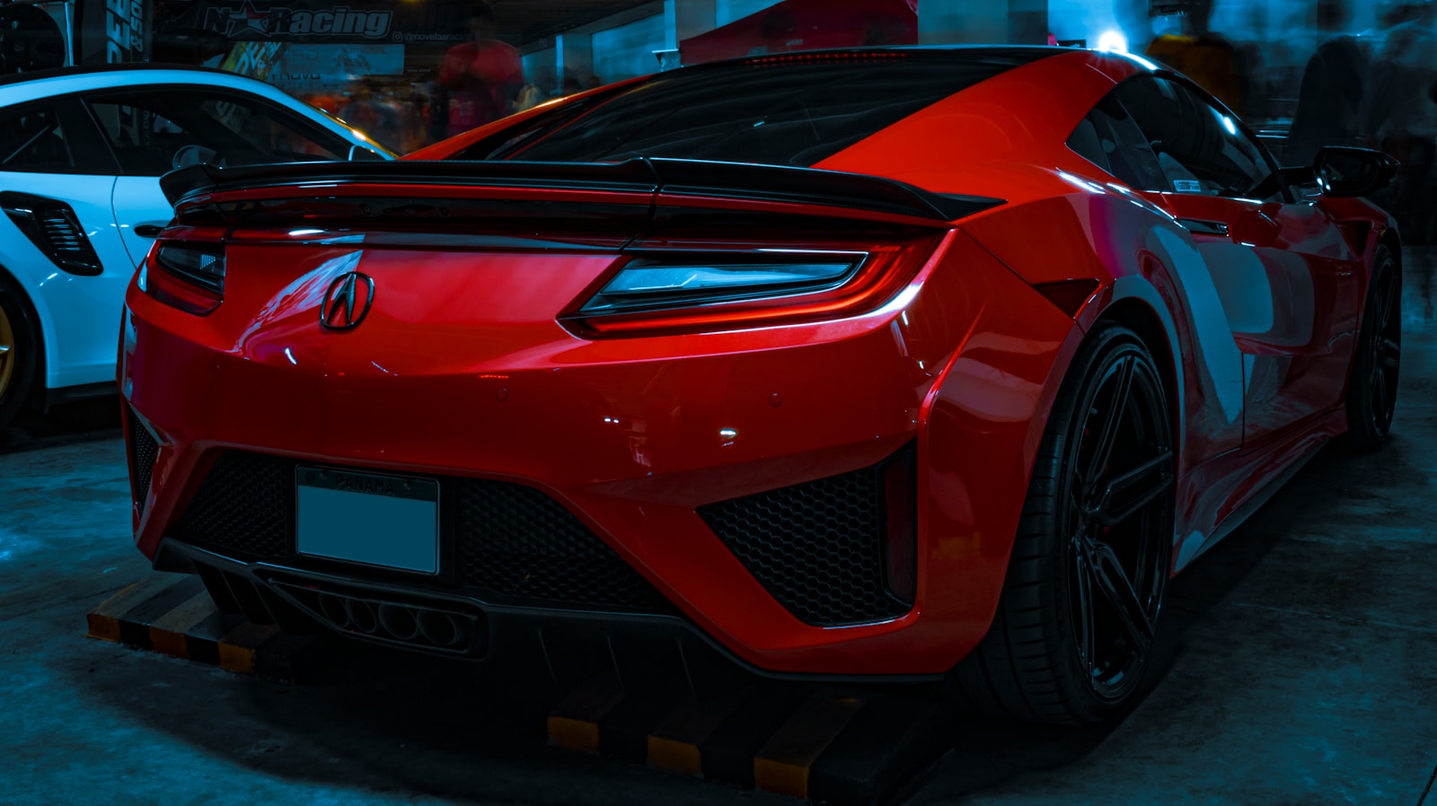 a red sports car parked in a garage