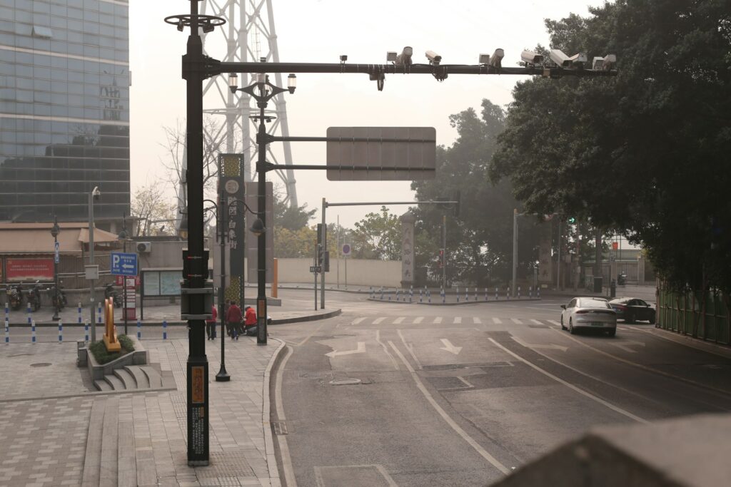 Urban street intersection with traffic lights and cars