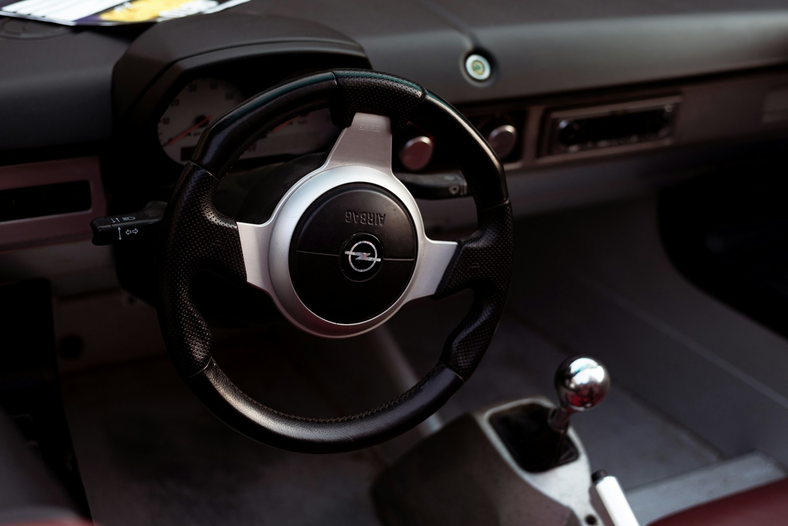 a steering wheel and dashboard of a car