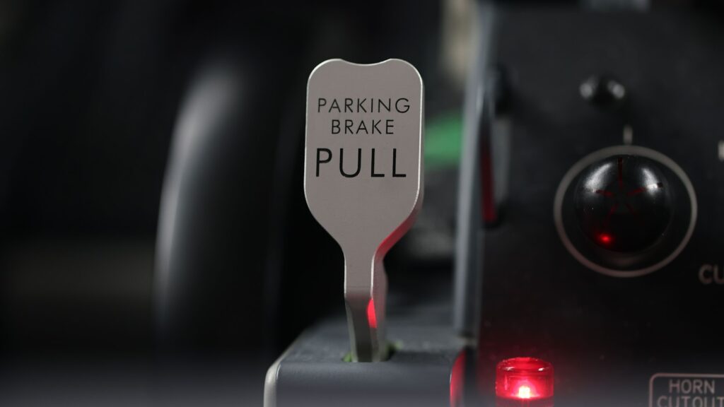 a parking brake pull sign with a red light