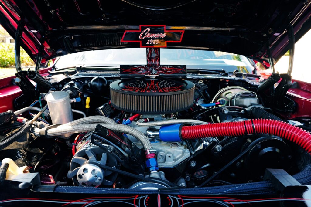 The engine compartment of a car with the hood up