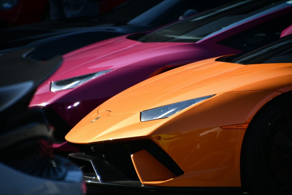 Colorful sports cars are parked in a row.