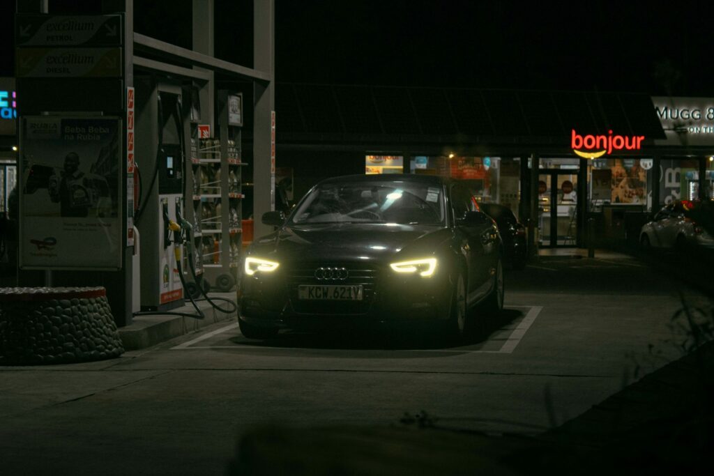 A car driving down a street at night