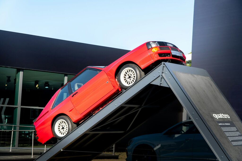 Red audi quattro is on a ramp.