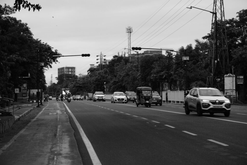 Cars and traffic on a city road.