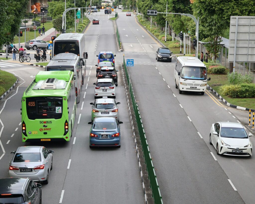Traffic jam on a multi-lane road with buses and cars.