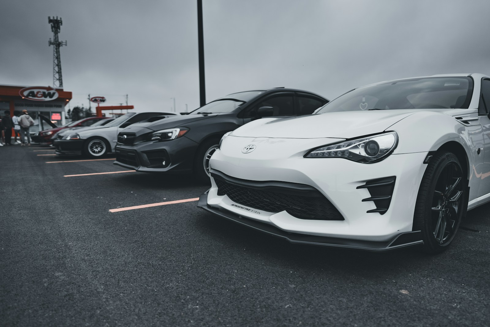 a group of cars parked in a parking lot