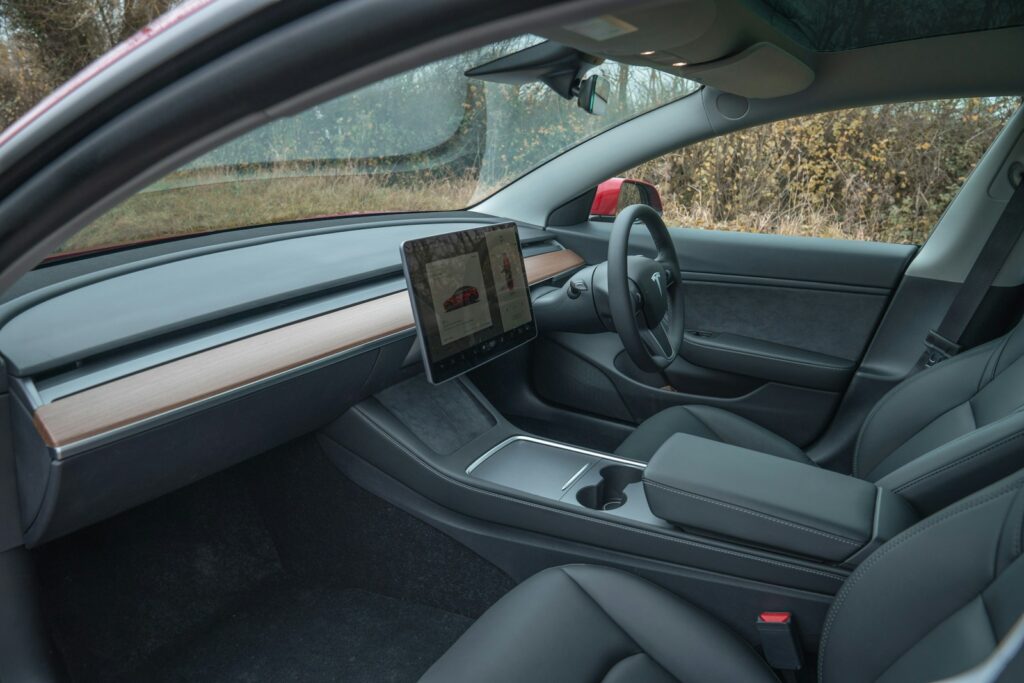 Interior view of a modern car with a large touchscreen.