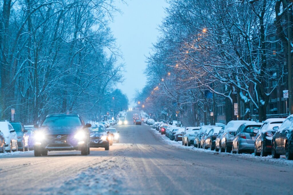 Snowy street with cars during winter.