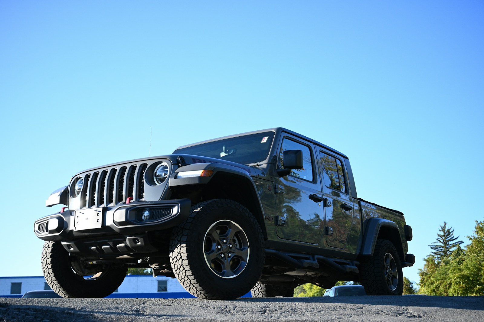 a black jeep parked on the side of a road