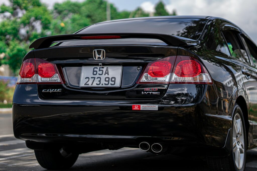 a black car parked on the side of the road