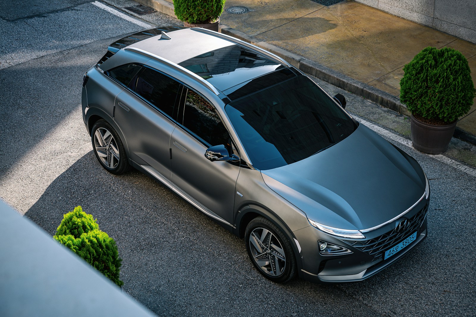 a silver car parked on the side of the road
