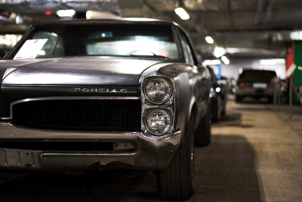 a black car parked in a parking garage
