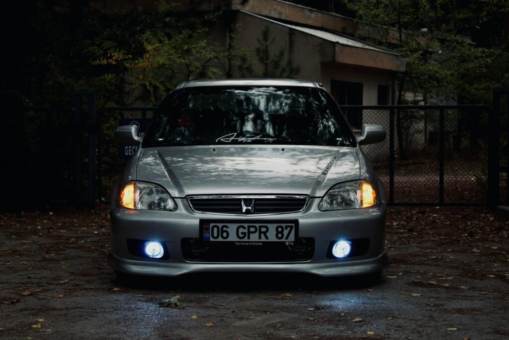 Front view of a shiny Honda sedan parked in a residential area in Turkey at dusk.